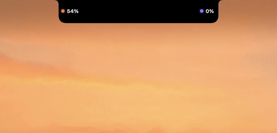 NotchPilot collapsed on the MacBook notch — Claude and Codex token quota, glanceable on the desktop wallpaper